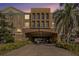Building exterior featuring a grand entrance and landscaping at 4221 W Spruce St # 2418, Tampa, FL 33607