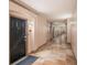 Building hallway with tile floors and access to units at 4221 W Spruce St # 2418, Tampa, FL 33607