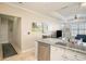 Kitchen with island, granite counters and view of entry at 4221 W Spruce St # 2418, Tampa, FL 33607