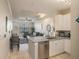 Modern kitchen with white cabinets and granite countertops at 4221 W Spruce St # 2418, Tampa, FL 33607