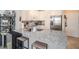 Kitchen with white cabinets, granite counters and island at 4221 W Spruce St # 2418, Tampa, FL 33607