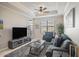 Living room with comfortable seating and large TV at 4221 W Spruce St # 2418, Tampa, FL 33607