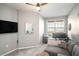 Home office features a desk, couch, and large TV at 4221 W Spruce St # 2418, Tampa, FL 33607