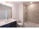 Modern bathroom with shower, tub, and vanity at 479 Winwood Ct, Port Charlotte, FL 33954