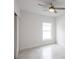 Simple bedroom with window, closet, and ceiling fan at 479 Winwood Ct, Port Charlotte, FL 33954