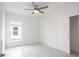 Bright bedroom featuring ceiling fan and tile floor at 479 Winwood Ct, Port Charlotte, FL 33954