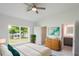 Bright bedroom with backyard view, walk-in closet, and ensuite bathroom at 479 Winwood Ct, Port Charlotte, FL 33954