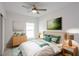 Bedroom with light and airy feel, featuring a plush bed and wood dresser at 479 Winwood Ct, Port Charlotte, FL 33954
