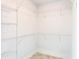 Walk-in closet with wire shelving, offering ample storage space at 479 Winwood Ct, Port Charlotte, FL 33954
