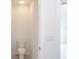 Small half bathroom with toilet and pedestal sink at 479 Winwood Ct, Port Charlotte, FL 33954