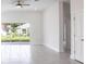 Bright living room with tile floors and sliding glass doors leading to the backyard at 479 Winwood Ct, Port Charlotte, FL 33954