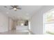 Open floorplan with kitchen and living room, featuring tile floors at 479 Winwood Ct, Port Charlotte, FL 33954