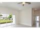 Spacious living area featuring tile floors and access to a private backyard at 479 Winwood Ct, Port Charlotte, FL 33954
