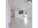 Open concept living room with kitchen views and tile flooring throughout at 479 Winwood Ct, Port Charlotte, FL 33954