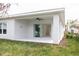 Covered patio with sliding glass doors and ceiling fan at 479 Winwood Ct, Port Charlotte, FL 33954