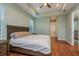 Main bedroom with wood flooring and access to bathroom at 511 Roanoke St, Dunedin, FL 34698