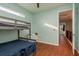 Bedroom with wood floors, bunk bed, and hallway view at 511 Roanoke St, Dunedin, FL 34698