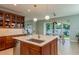 Modern kitchen with large island and breakfast bar at 511 Roanoke St, Dunedin, FL 34698