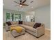 Spacious living room with large sectional sofa and sliding glass doors at 511 Roanoke St, Dunedin, FL 34698