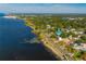 Aerial view showcasing a waterfront home and surrounding neighborhood at 55 Edgewater Dr, Dunedin, FL 34698