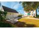 Private backyard oasis with patio and white chairs at 55 Edgewater Dr, Dunedin, FL 34698