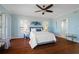 Spacious bedroom with hardwood floors and large windows at 55 Edgewater Dr, Dunedin, FL 34698