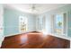 Bedroom with water views and hardwood floors at 55 Edgewater Dr, Dunedin, FL 34698