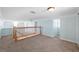 Spacious bonus room with carpet and large window at 55 Edgewater Dr, Dunedin, FL 34698