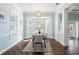 Light and airy dining room with bay window and modern dining table for four at 55 Edgewater Dr, Dunedin, FL 34698