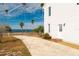 White house with driveway and waterfront view at 55 Edgewater Dr, Dunedin, FL 34698