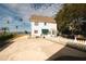 Charming white house with green awning and waterfront view at 55 Edgewater Dr, Dunedin, FL 34698
