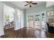 Modern kitchen with white cabinets, granite countertops, and access to backyard at 55 Edgewater Dr, Dunedin, FL 34698