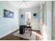 Bright home office with wood floors and built-in shelving at 55 Edgewater Dr, Dunedin, FL 34698