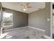 Bedroom with large window, ceiling fan, and tile floors at 6210 68Th E Dr, Palmetto, FL 34221