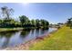 Peaceful view of a canal with lush greenery at 6210 68Th E Dr, Palmetto, FL 34221