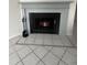 Modern fireplace with tile surround and built-in shelving at 6730 121St Ave # 1, Largo, FL 33773