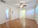 Spacious bedroom with wood floors and access to other rooms at 764 Ruskin Rd, Clearwater, FL 33765