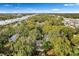 High-angle view of the property nestled among trees, showing the nearby highway and cityscape at 807 E Genesee St # 1/2, Tampa, FL 33603