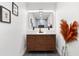 Modern bathroom vanity with wood cabinet, double sinks, and large mirror at 807 E Genesee St # 1/2, Tampa, FL 33603