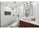 Modern bathroom with marble tile shower, contemporary vanity, and sleek fixtures at 807 E Genesee St # 1/2, Tampa, FL 33603