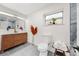 Modern bathroom with double vanity, wood cabinet, and gray tile floor at 807 E Genesee St # 1/2, Tampa, FL 33603