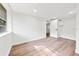 Bright, empty bedroom with wood-look floors and white walls at 807 E Genesee St # 1/2, Tampa, FL 33603