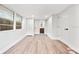 Bright bedroom with large windows, wood-look flooring, and ensuite bathroom access at 807 E Genesee St # 1/2, Tampa, FL 33603
