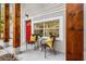 Relaxing front porch with seating, a red door, and wooden accents at 807 E Genesee St # 1/2, Tampa, FL 33603