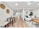 Open-concept living area with modern wood flooring, dining space, and neutral decor at 807 E Genesee St # 1/2, Tampa, FL 33603