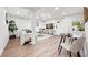 Inviting living room with comfortable seating, wood flooring, and a dining table at 807 E Genesee St # 1/2, Tampa, FL 33603