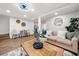 Inviting living room with a cozy sofa, coffee table, and dining area at 807 E Genesee St # 1/2, Tampa, FL 33603