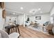 Bright and airy living room with wood flooring, a dining table, and stylish furniture at 807 E Genesee St # 1/2, Tampa, FL 33603