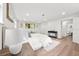 Main bedroom with ensuite bathroom, wood-look floors, and natural light at 807 E Genesee St # 1/2, Tampa, FL 33603