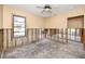 Unfinished bedroom awaiting renovation. Shows framing and flooring at 815 Lantana Ave, Clearwater Beach, FL 33767
